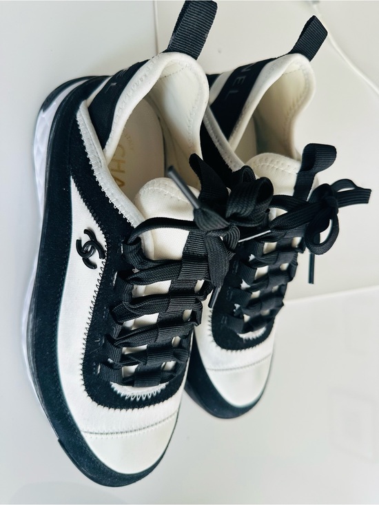 CHANEL Shoes - CHANEL Black and White Low-Top Sneakers with Ribbon Laces